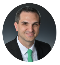Headshot of Kentucky Farmers Bank VP Loan Project Manager. He is smiling, wearing a suit with a white shirt and green tie against a grey background.